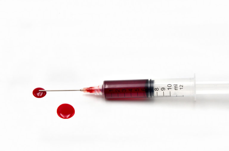 blood syringe white background
