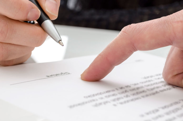 contract-closeup-pointing-to-where-to-sign-2400