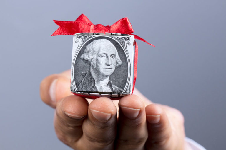 dollar-wrapped-as-present-iStock-Solid-Colours-486564188-1000