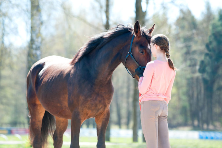 girl-horse-outside-love-iStock-Anna-Elizabeth-Photography-882224586-2400
