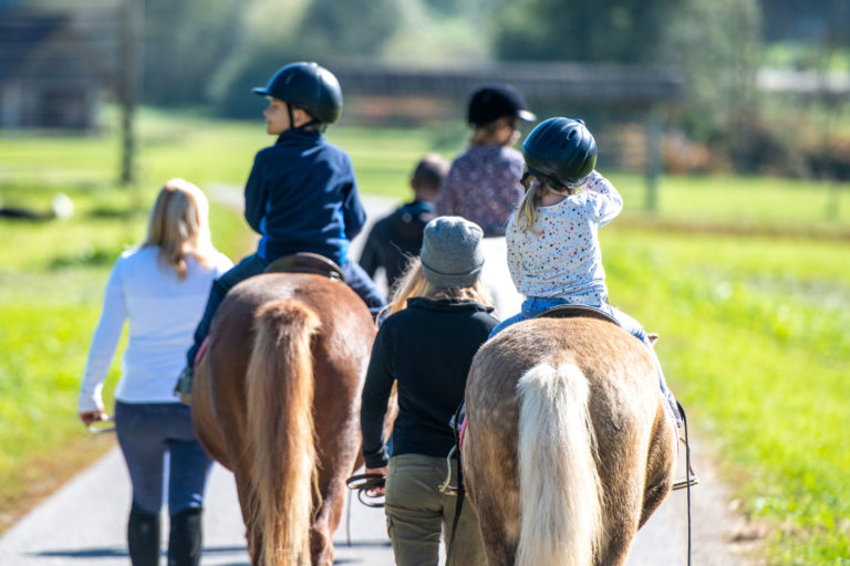 kids-riding-horses-being-lead-iStock-VM-1145104179-2400