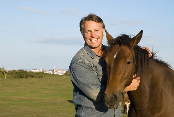 man-smiling-arms-around-horse-neck-1