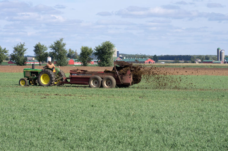 manure-spreader-tractor-field-iStock-Simply-Creative-Photography-1047851972-1000