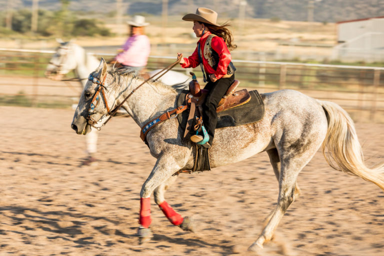 old-horse-girl-riding-western-iStock-Jason-Doly-908699646-1200