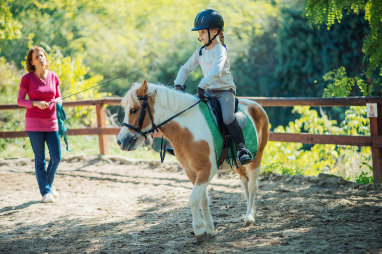 pony-girl-instructor-lesson-iStock-857895966-1000
