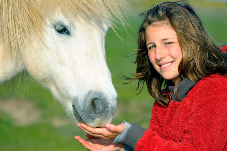 miniature-horse-pony-young-girl-happy-GettyImages-155441849-1200